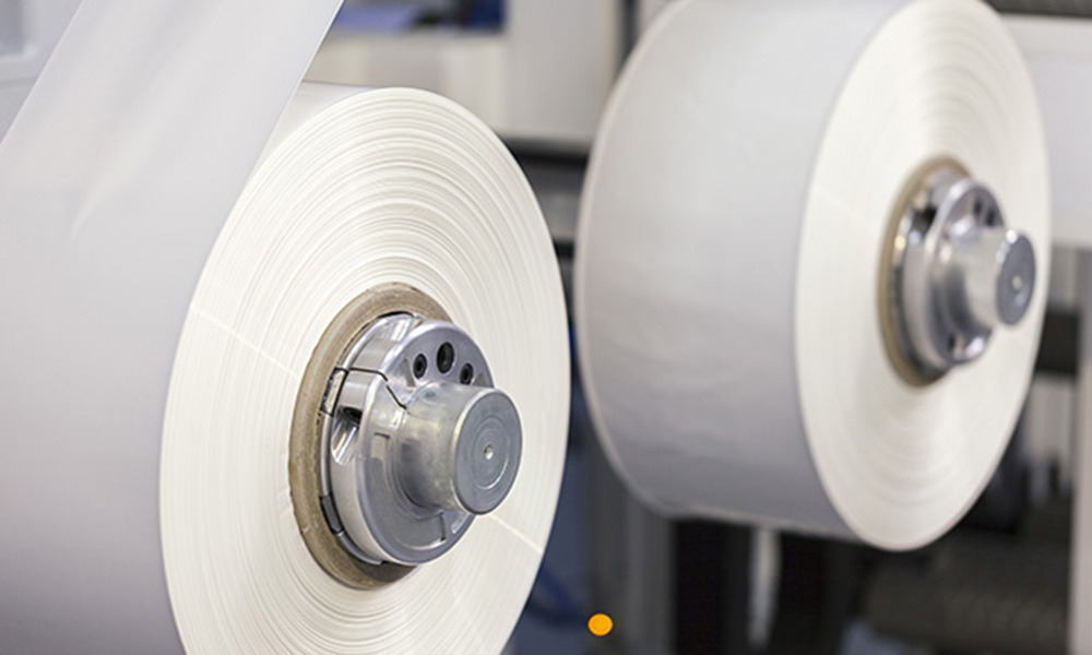 Colored and white rolls of thermal transfer printer labels. Various shapes for direct printing.