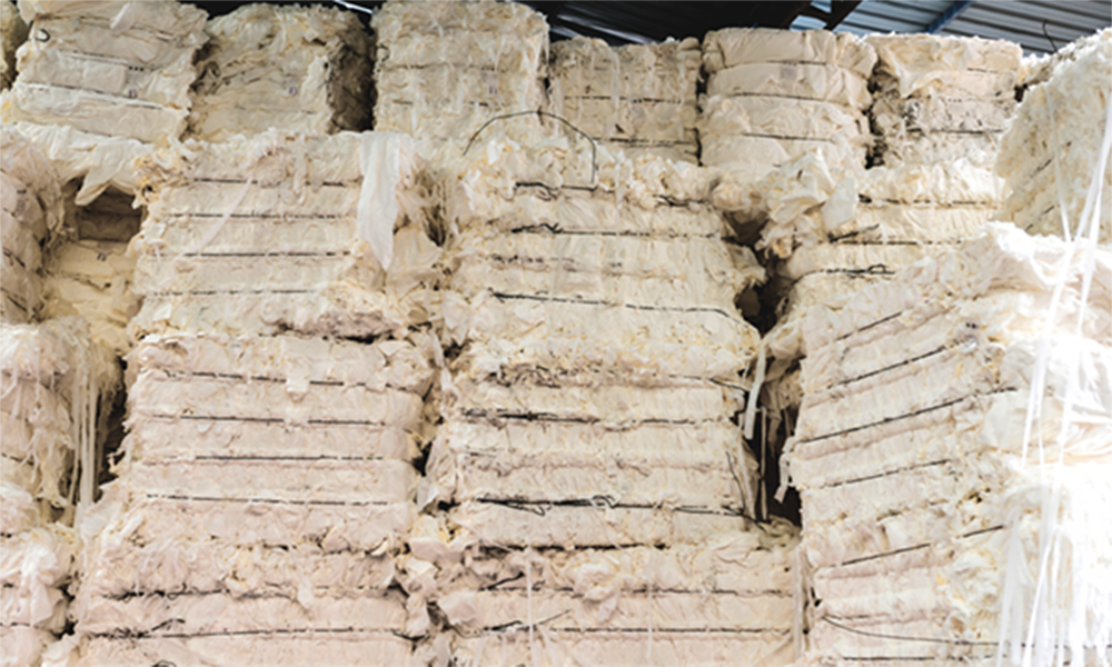 Stacks of dried pulp sheets, representing Momentive’s Silwet™ DA surfactants for efficient drainage, reduced water retention, and sustainable pulp washing processes.