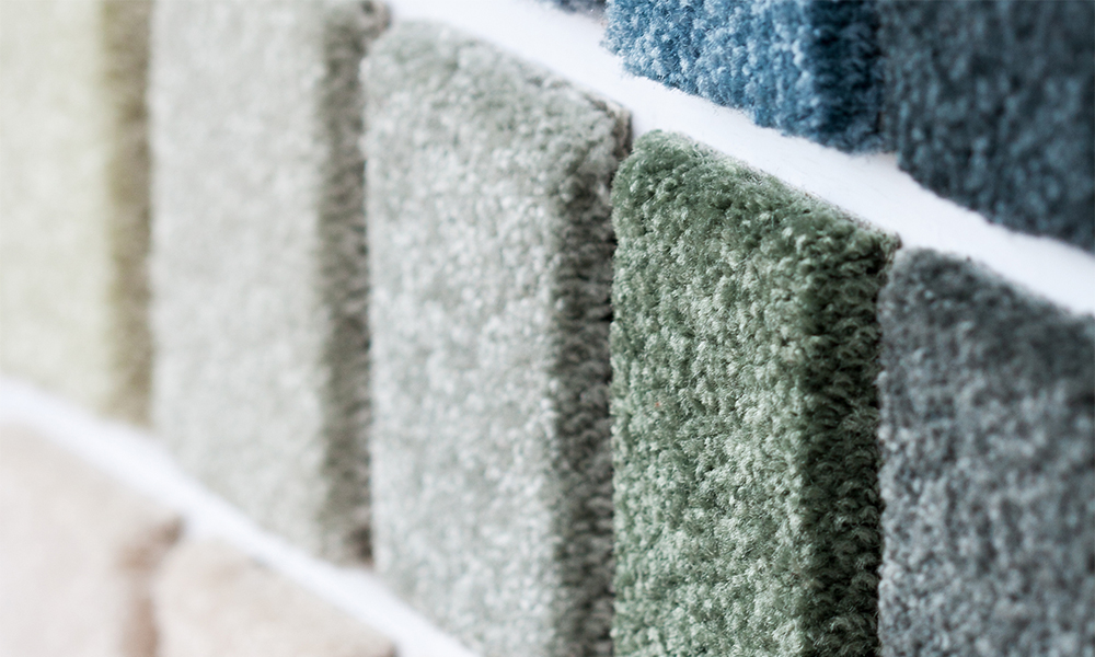 Close-up of carpet swatches illustrating Niax catalysts for enhanced polyurethane foam performance and durability.