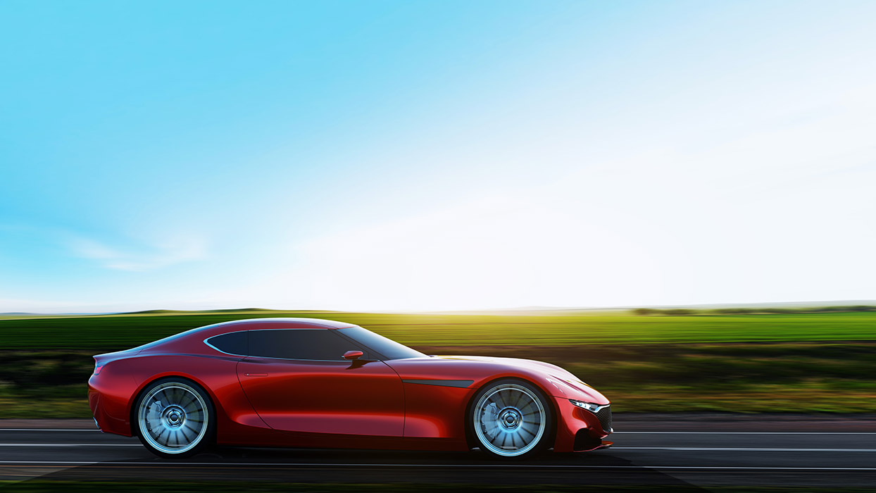 Red Car driving down highway